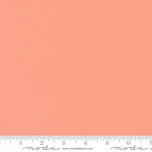 Cotton quilting fabric pattern called 'Peach Blossom'. Part of the 'Bella Solids' fabric collection. Designed by Moda Fabrics for fabric company Moda Fabrics. SKU: 9900 297. 44-45 inch width.