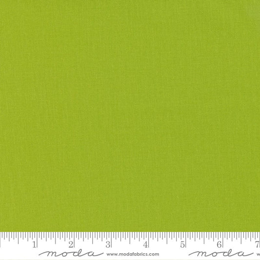 Cotton quilting fabric pattern called 'Limeade'. Part of the 'Bella Solids' fabric collection. Designed by Moda Fabrics for fabric company Moda Fabrics. SKU: 9900 369. 44-45 inch width.