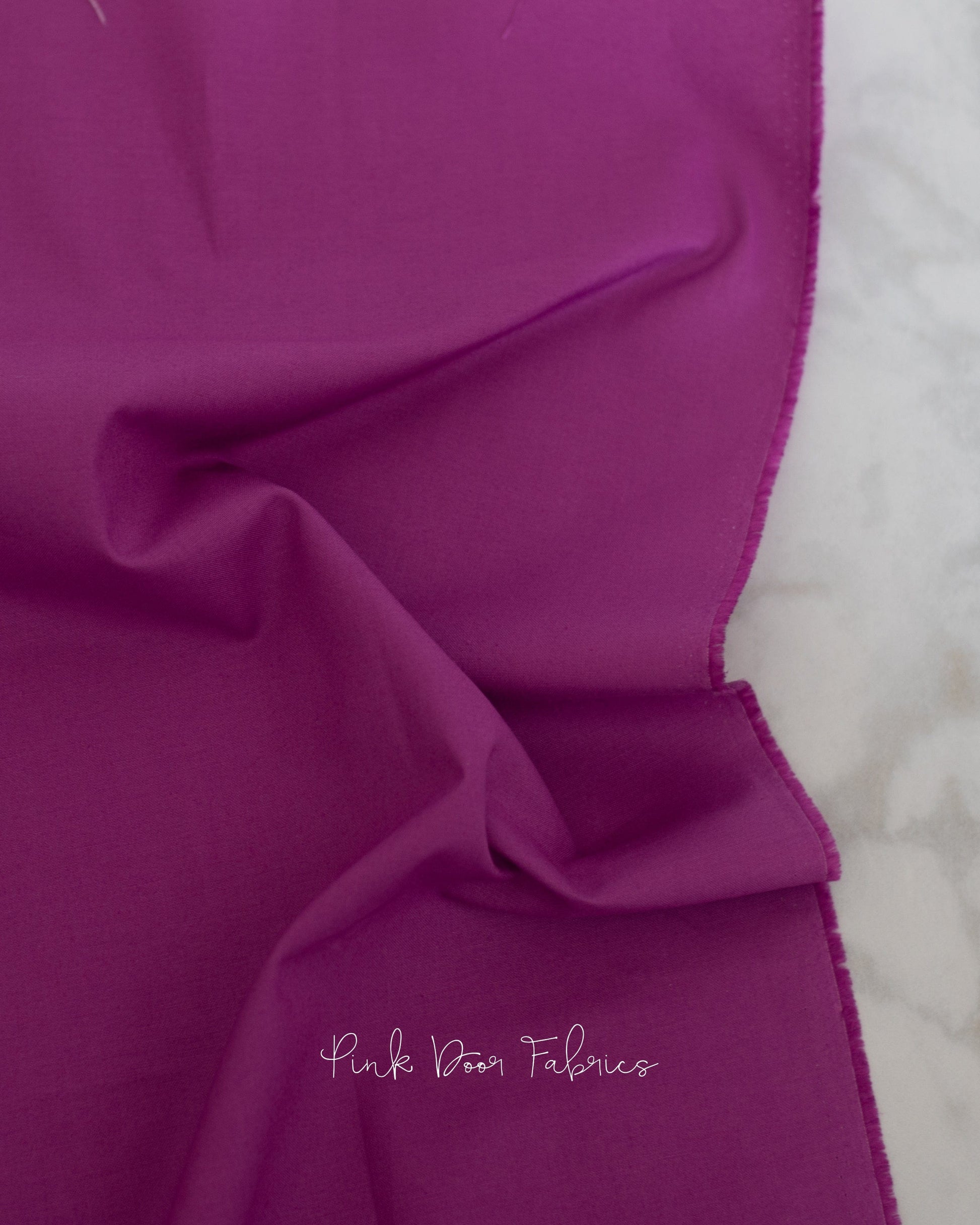 Cotton quilting fabric pattern called 'Dragon's Breath in Amethyst'. Part of the 'True Colors' fabric collection. Designed by Tula Pink for fabric company Free Spirit Fabrics. SKU: CSFSESS.AMETHYST. 44-45 inch width.