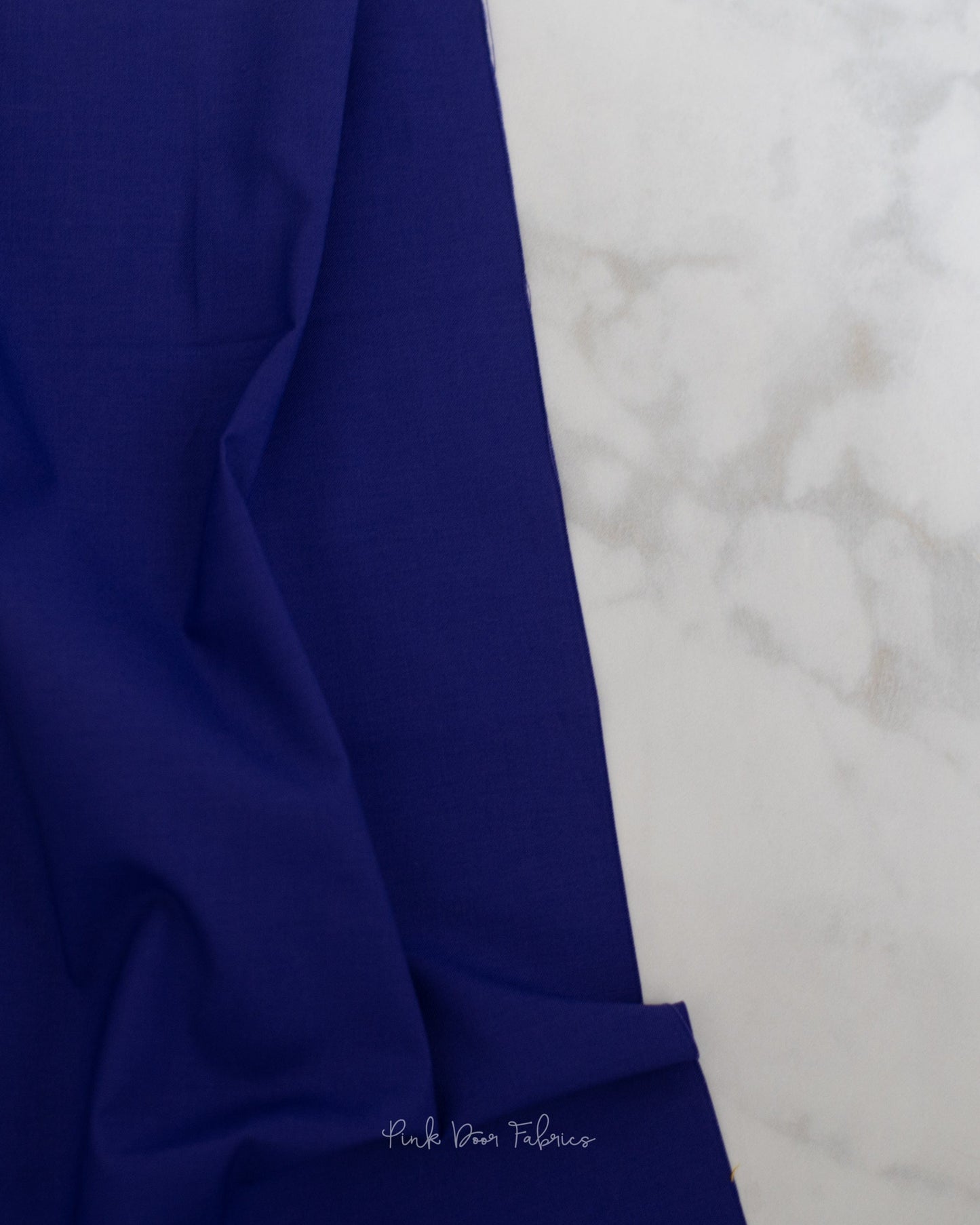 Cotton quilting fabric pattern called 'Solid in Diva'. Part of the 'True Colors' fabric collection. Designed by Tula Pink for fabric company Free Spirit Fabrics. SKU: CSFSESS.DIVA. 44-45 inch width.