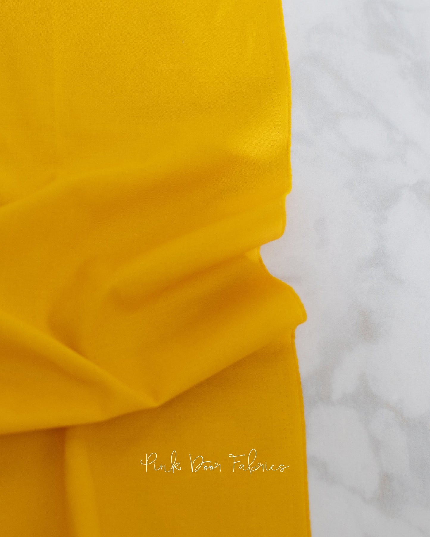 Cotton quilting fabric pattern called 'Dragon's Breath in Marigold'. Part of the 'True Colors' fabric collection. Designed by Tula Pink for fabric company Free Spirit Fabrics. SKU: CSFSESS.MARIGOLD. 44-45 inch width.