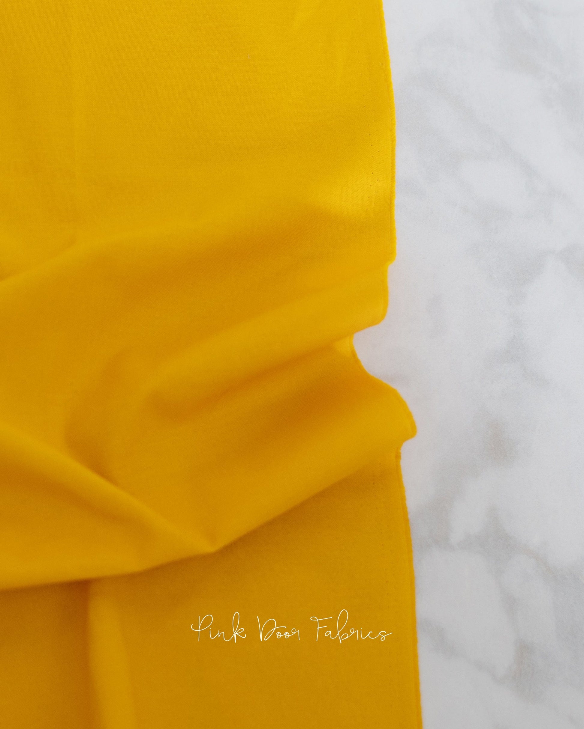 Cotton quilting fabric pattern called 'Dragon's Breath in Marigold'. Part of the 'True Colors' fabric collection. Designed by Tula Pink for fabric company Free Spirit Fabrics. SKU: CSFSESS.MARIGOLD. 44-45 inch width.