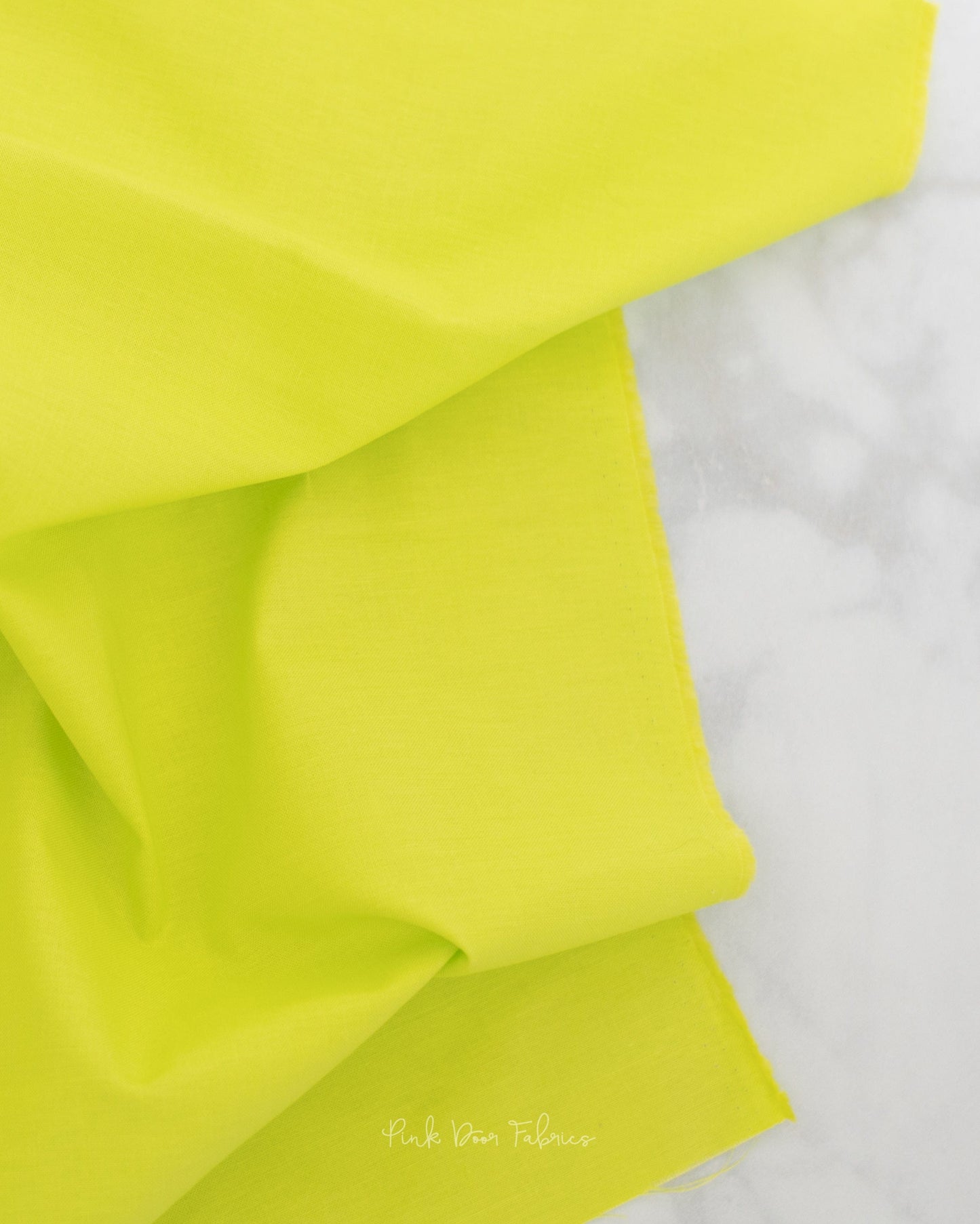 Cotton quilting fabric pattern called 'Solid in Mojito'. Part of the 'True Colors' fabric collection. Designed by Tula Pink for fabric company Free Spirit Fabrics. SKU: CSFSESS.MOJITO. 44-45 inch width.