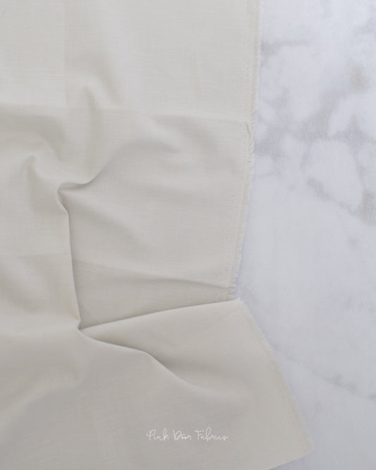 Cotton quilting fabric pattern called 'Solid in Putty'. Part of the 'True Colors' fabric collection. Designed by Tula Pink for fabric company Free Spirit Fabrics. SKU: CSFSESS.PUTTY. 44-45 inch width.
