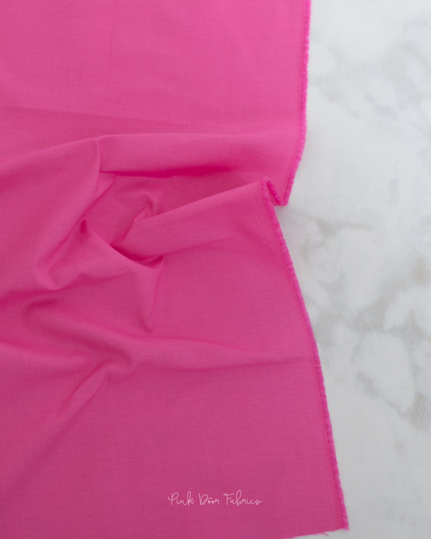 Cotton quilting fabric pattern called 'Solid in Tula Pink'. Part of the 'True Colors' fabric collection. Designed by Tula Pink for fabric company Free Spirit Fabrics. SKU: CSFSESS.TULA. 44-45 inch width.