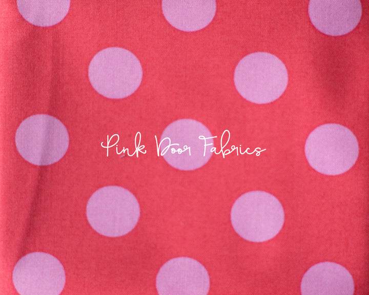 Cotton quilting fabric pattern called 'Pom Poms in Poppy'. Part of the 'True Colors' fabric collection. Designed by Tula Pink for fabric company Free Spirit Fabrics. SKU: PWTP118.POPPY. 44-45 inch width.