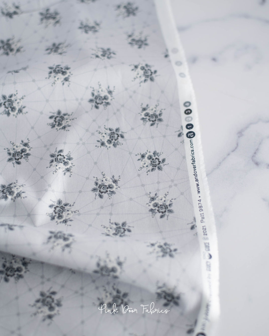 Cotton quilting fabric pattern called 'Little Bouquets in Classic Grey'. Part of the 'Nonna' fabric collection. Designed by Giucy Giuce for fabric company Andover Fabrics. SKU: A-9874-C. 44-45 inch width.