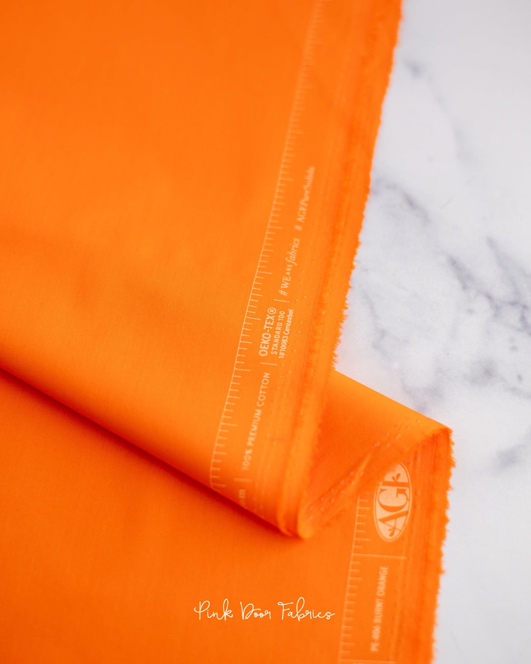 Cotton quilting fabric pattern called 'Burnt Orange'. Part of the 'Pure Solids' fabric collection. Designed by Art Gallery Fabrics for fabric company Art Gallery Fabrics. SKU: PE-406. 44-45 inch width.