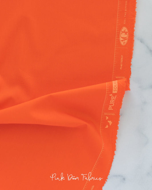 Cotton quilting fabric pattern called 'Tigerlily'. Part of the 'Pure Solids' fabric collection. Designed by Art Gallery Fabrics for fabric company Art Gallery Fabrics. SKU: PE-461. 44-45 inch width.