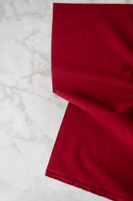 Cotton quilting fabric pattern called 'Candied Cherry'. Part of the 'Pure Solids' fabric collection. Designed by Art Gallery Fabrics for fabric company Art Gallery Fabrics. SKU: PE-491. 44-45 inch width.