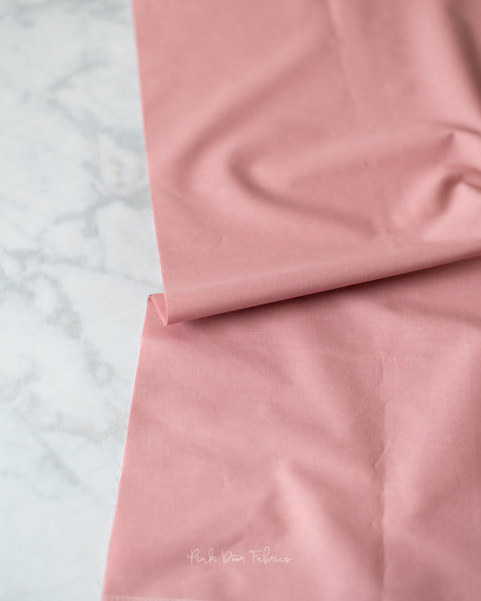 Cotton quilting fabric pattern called 'Sugar Plum'. Part of the 'Pure Solids' fabric collection. Designed by Art Gallery Fabrics for fabric company Art Gallery Fabrics. SKU: PE-506. 44-45 inch width.