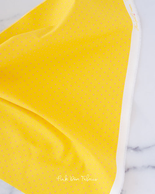 Cotton quilting fabric pattern called 'Tiny Dots in Flare'. Part of the 'True Colors' fabric collection. Designed by Tula Pink for fabric company Free Spirit Fabrics. SKU: PWTP185.FLARE. 44-45 inch width.