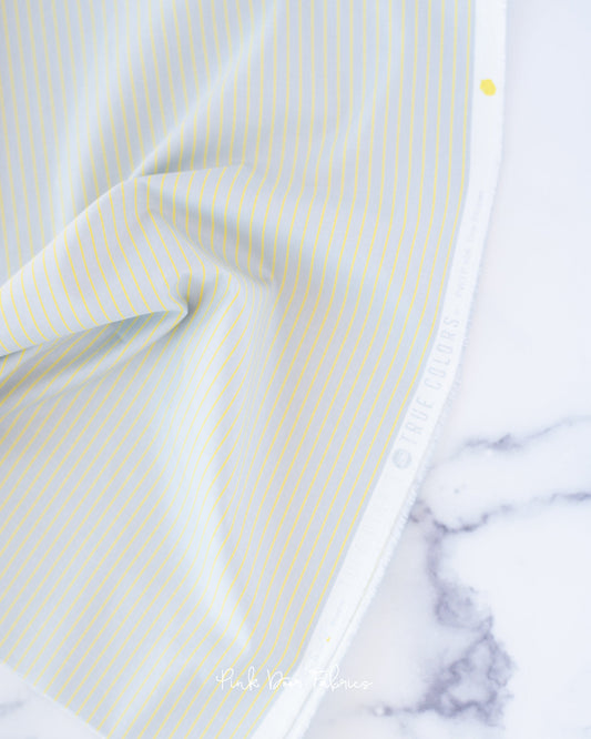 Cotton quilting fabric pattern called 'Tiny Stripes in Spark'. Part of the 'True Colors' fabric collection. Designed by Tula Pink for fabric company Free Spirit Fabrics. SKU: PWTP186.SPARK. 44-45 inch width.