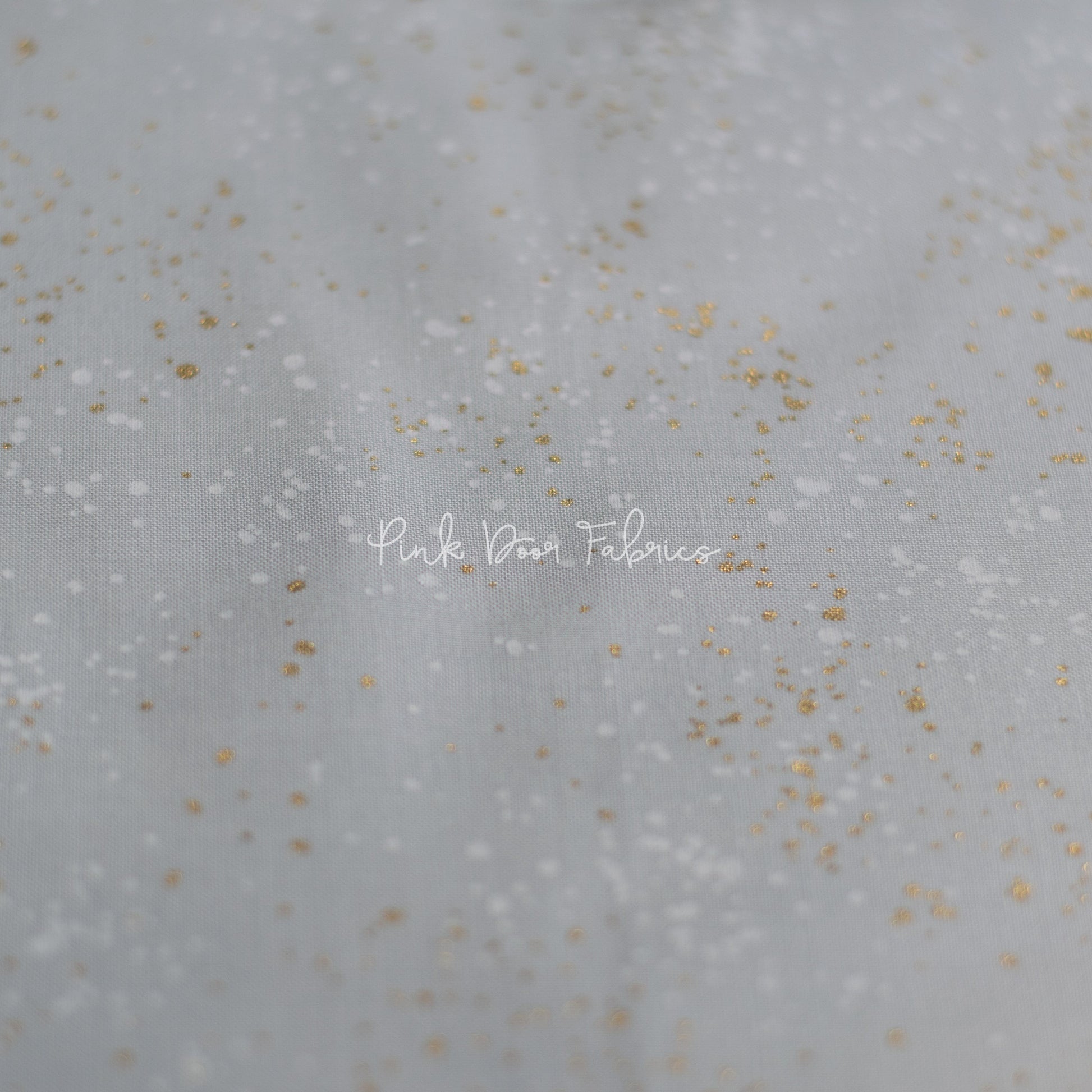 Cotton quilting fabric pattern called 'Dove'. Part of the 'Speckled Metallic' fabric collection. Designed by Ruby Star Society for fabric company Moda Fabrics. SKU: RS5027 59M. 44-45 inch width.