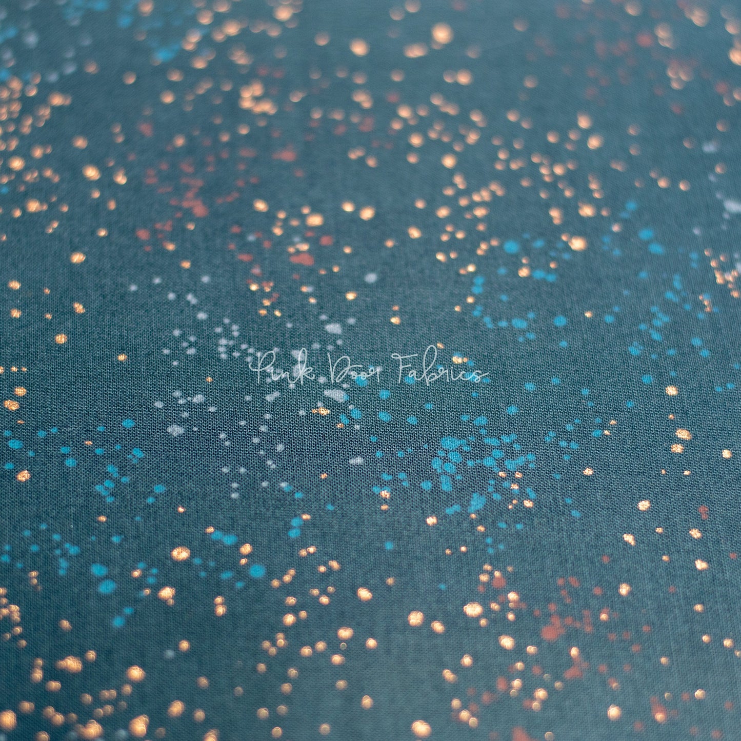 Cotton quilting fabric pattern called 'Teal Navy'. Part of the 'Speckled Metallic' fabric collection. Designed by Ruby Star Society for fabric company Moda Fabrics. SKU: RS5027 55M. 44-45 inch width.