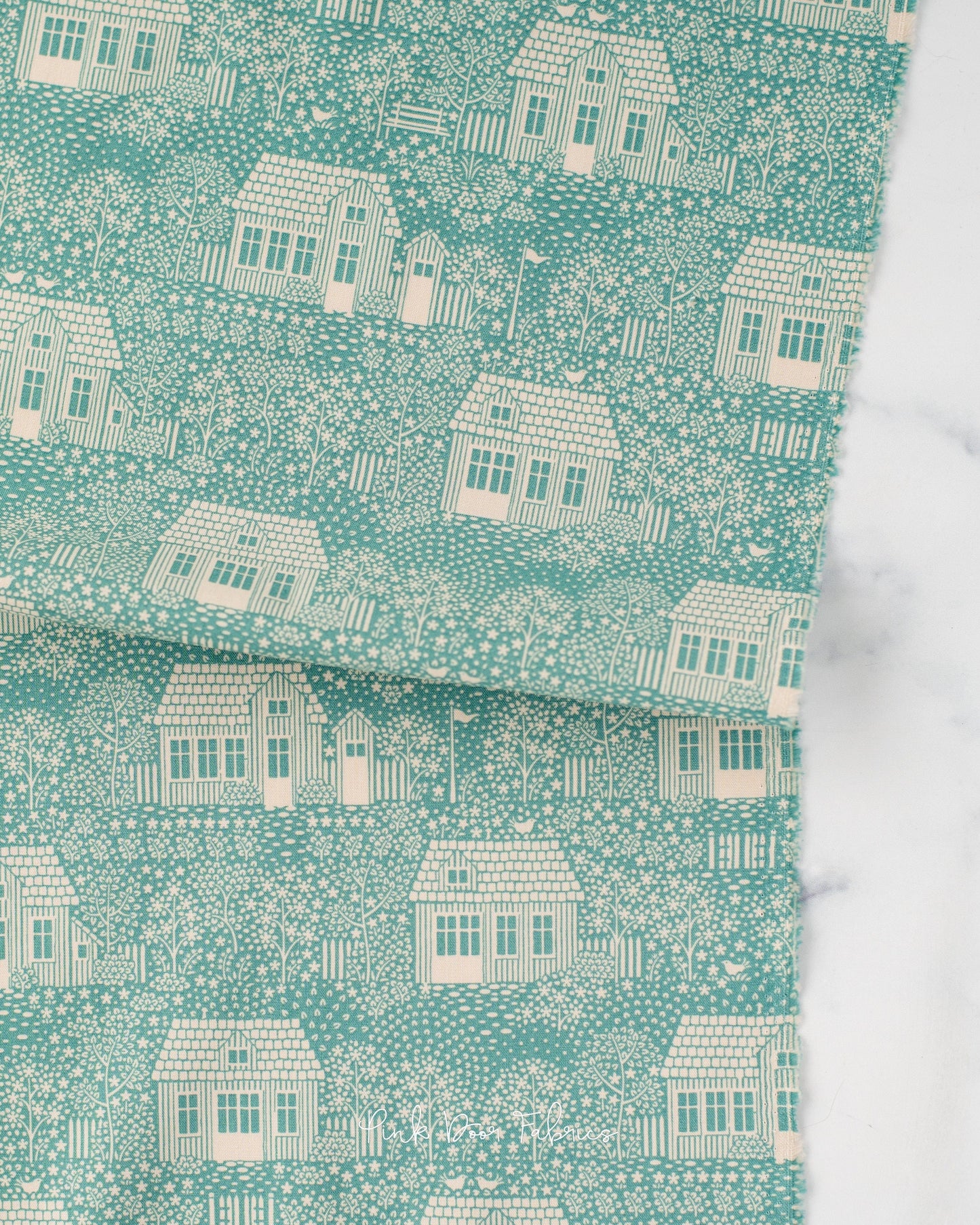 Cotton quilting fabric pattern called 'My Neighborhood Teal'. Part of the 'Hometown' fabric collection. Designed by Tilda Fabrics for fabric company Tilda Fabrics. SKU: 110061. 44-45 inch width.