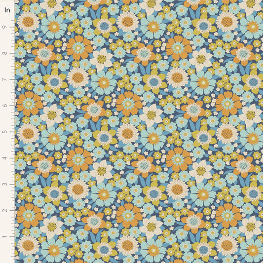 A closeup shot of the quilting fabric pattern called Lauren, designed by Tone Finnanger, in the blue colorway. The SKU is TIL100603.