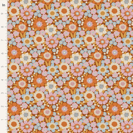 A closeup shot of the quilting fabric pattern called Lauren, designed by Tone Finnanger, in the caramel colorway. The SKU is TIL100604.
