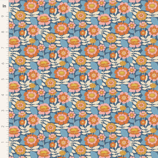 A closeup of the quilting fabric pattern called Beverly, designed by Tone Finnanger, in the blue colorway. The SKU is TIL100611.