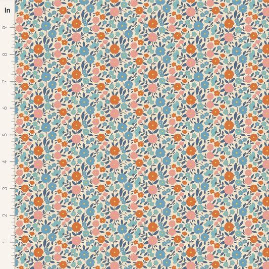 A closeup shot of the quilting fabric pattern called Janice, designed by Tone Finnanger, in the blue colorway. The SKU is TIL100615.