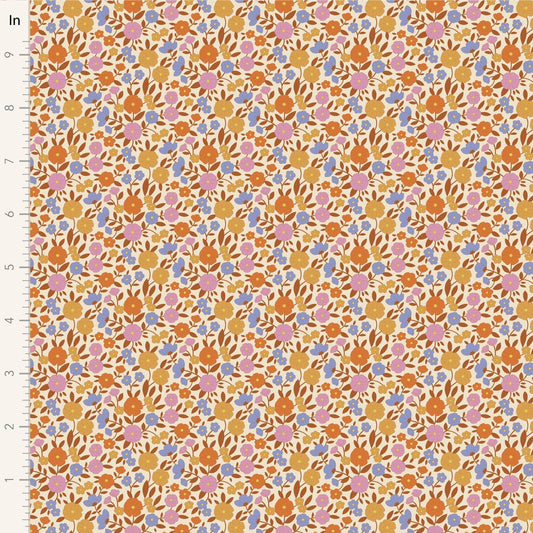 A closeup shot of the quilting fabric pattern called Janice, designed by Tone Finnanger, in the caramel colorway. The SKU is TIL100616.