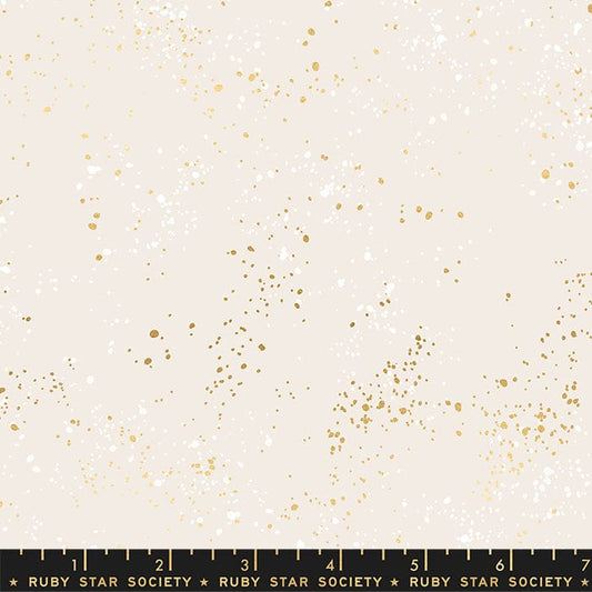 Cotton quilting fabric pattern called '108" Wide Speckled in White Gold'. Part of the 'Speckled Wideback' fabric collection. Designed by Ruby Star Society for fabric company Moda Fabrics. SKU: RS5055 14M. 44-45 inch width.