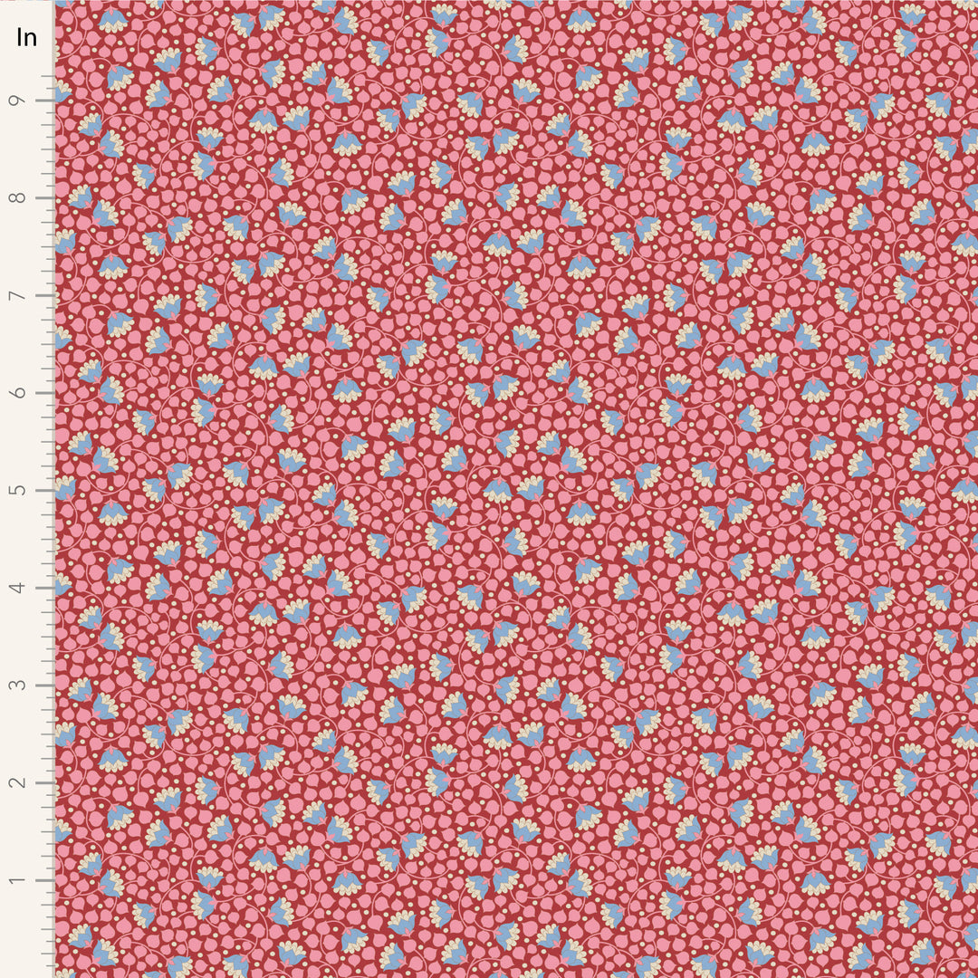 A closeup shot of the quilting fabric pattern called Bellflower, designed by Tone Finnanger, in the pink colorway. The SKU is TIL110129.