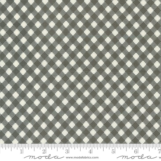 Cotton quilting fabric pattern called 'Bias Gingham in Charcoal'. Part of the 'Farmstead' fabric collection. Designed by Stacy Iest Hsu for fabric company MODA. SKU: 20907 16. 44-45 inch width.