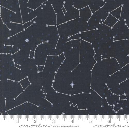 A closeup shot of the quilting fabric pattern called The Constellation, designed by Stacy Iest Hsu, in the night sky colorway. The SKU is 20954 15.