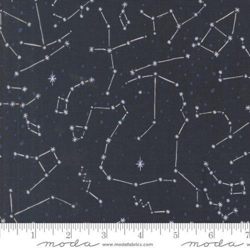 A closeup shot of the quilting fabric pattern called The Constellation, designed by Stacy Iest Hsu, in the night sky colorway. The SKU is 20954 15.