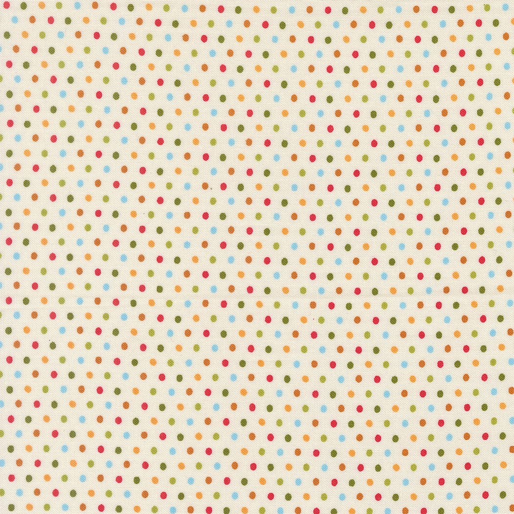 A closeup shot of the quilting fabric pattern called Dotty Dot, designed by Stacy Iest Hsu, in the dove colorway. The SKU is 20967 11.