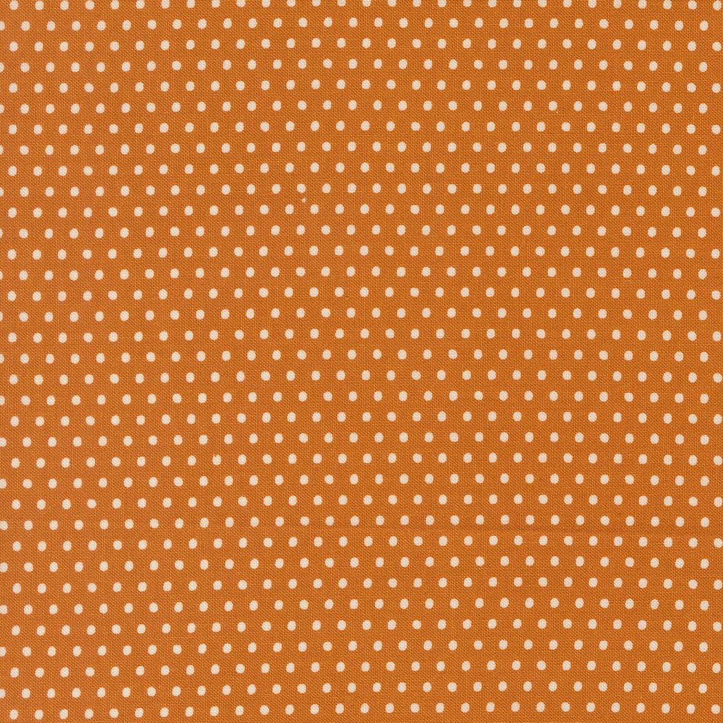 A closeup shot of the quilting fabric pattern called Dotty Dot, designed by Stacy Iest Hsu, in the tiger colorway. The SKU is 20967 17.