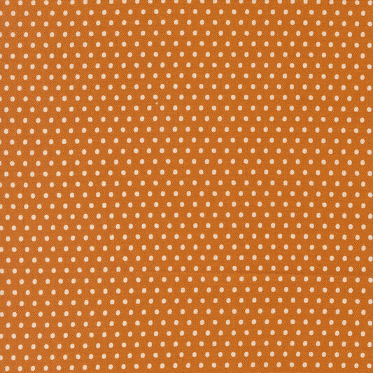 A closeup shot of the quilting fabric pattern called Dotty Dot, designed by Stacy Iest Hsu, in the tiger colorway. The SKU is 20967 17.