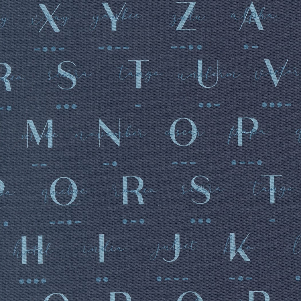 A closeup shot of the quilting fabric pattern called Phonetic Morse, designed by Sariditty, in the navy colorway. The SKU is 45062 18.