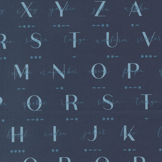 A closeup shot of the quilting fabric pattern called Phonetic Morse, designed by Sariditty, in the navy colorway. The SKU is 45062 18.