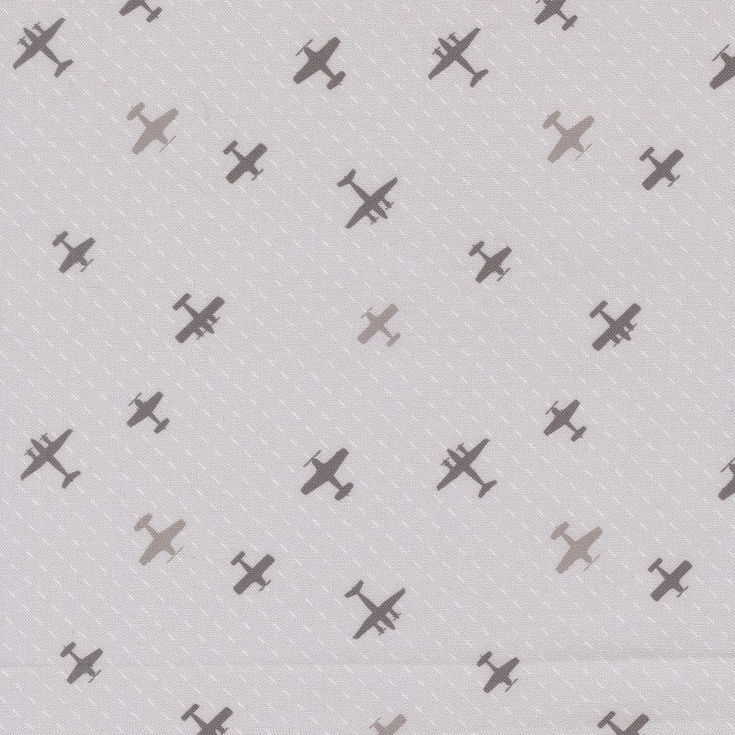 A closeup shot of the quilting fabric pattern called Flight Path, designed by Sariditty, in the smoke colorway. The SKU is 45064 21.