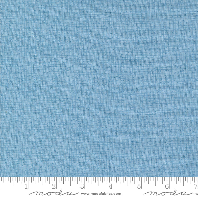 Cotton quilting fabric pattern called 'Thatched in Breeze'. Part of the 'Serena Shores' fabric collection. Designed by Robin Pickens for fabric company Moda. SKU: 48626 210. 44-45 inch width.