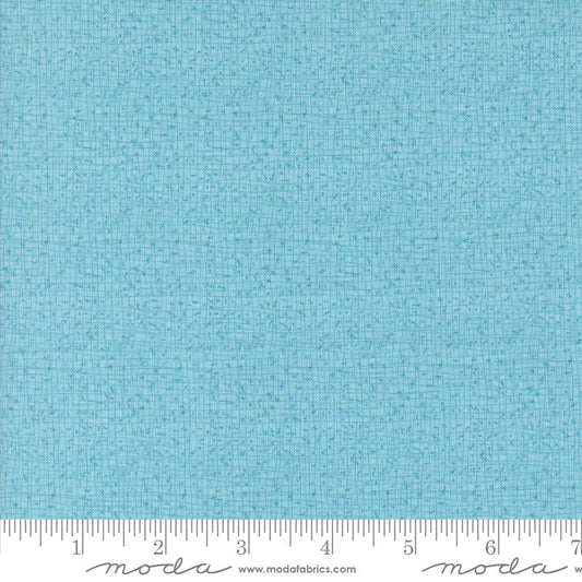 Cotton quilting fabric pattern called 'Thatched in Frost'. Part of the 'Serena Shores' fabric collection. Designed by Robin Pickens for fabric company Moda. SKU: 48626 211. 44-45 inch width.