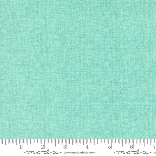 Cotton quilting fabric pattern called 'Thatched in Aqua'. Part of the 'Serena Shores' fabric collection. Designed by Robin Pickens for fabric company Moda. SKU: 48626 212. 44-45 inch width.