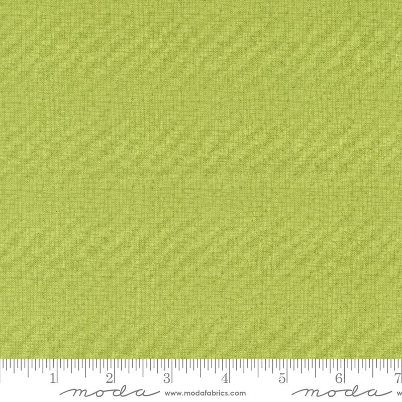 Cotton quilting fabric pattern called 'Thatched in Lime'. Part of the 'Serena Shores' fabric collection. Designed by Robin Pickens for fabric company Moda. SKU: 48626 214. 44-45 inch width.