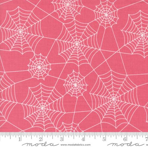 Cotton quilting fabric pattern called 'Webs in Love Potion Pink'. Part of the 'Hey Boo' fabric collection. Designed by Lella Boutique for fabric company Moda. SKU: 5213 14. 44-45 inch width.