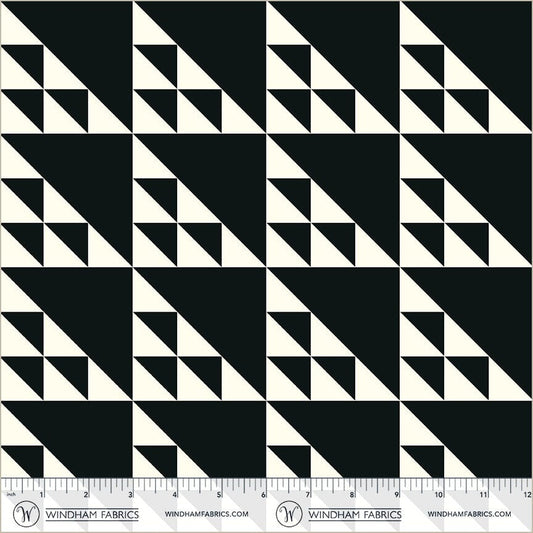 A closeup shot of the quilting fabric pattern called Birds in the Air, designed by Whistler Studios, in the black colorway. The SKU is 54880-3.