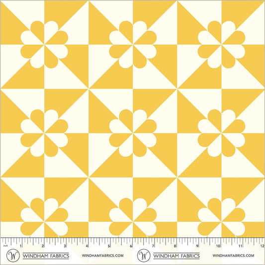 A closeup shot of the quilting fabric pattern called Hearts and Gizzards, designed by Whistler Studios, in the yellow colorway. The SKU is 54881-5.