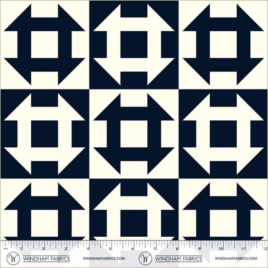 A closeup shot of the quilting fabric pattern called Churn Dash, designed by Whistler Studios, in the navy colorway. The SKU is 54882-2.