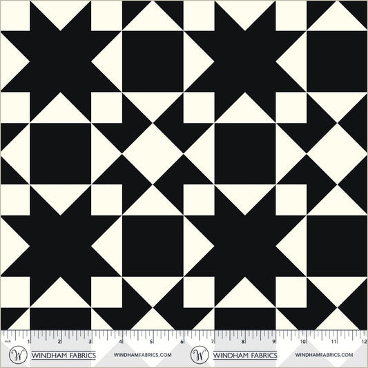 A closeup shot of the quilting fabric pattern called Sawtooth, designed by Whistler Studios, in the black colorway. The SKU is 54883-3.