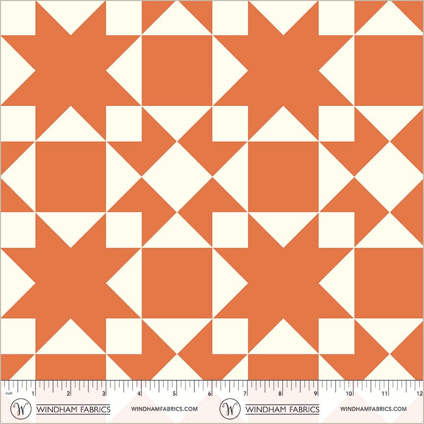 A closeup shot of the quilting fabric pattern called Sawtooth, designed by Whistler Studios, in the orange colorway. The SKU is 54883-8.