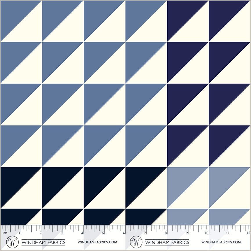 A closeup shot of the quilting fabric pattern called Half Square Triangle, designed by Whistler Studios,, in the blues colorway. The SKU is 54884-9.