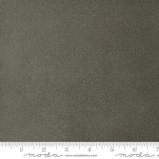 A close up shot of the fabric pattern called Fireside from Moda Fabrics, in the charcoal colorway. The SKU is 60001-56.