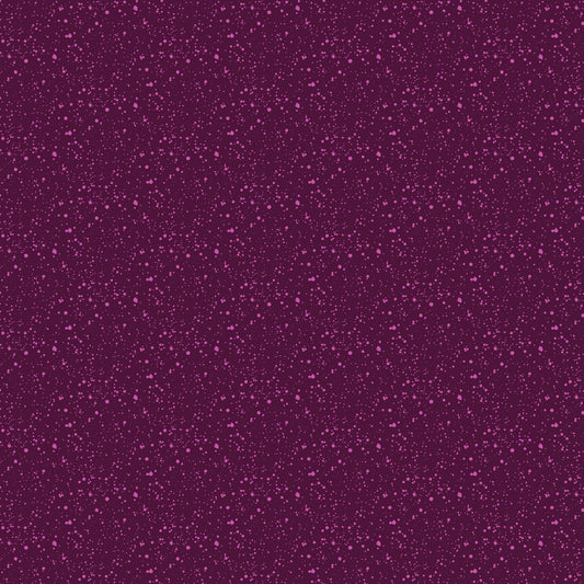 A closeup shot of the quilting fabric pattern called Splatter, designed by Josephine Kimberling, in the plum colorway. The SKU is 91063-84.