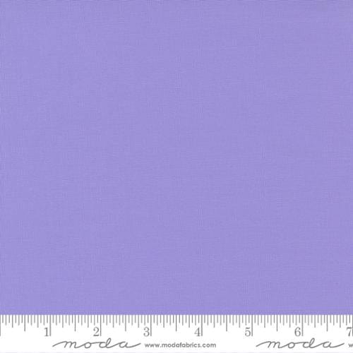 Cotton quilting fabric pattern called 'Amelia Lavender'. Part of the 'Bella Solids' fabric collection. Designed by Moda Fabrics for fabric company Moda Fabrics. SKU: 9900 164. 44-45 inch width.